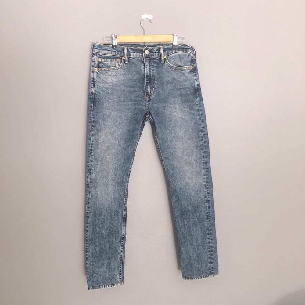 LEVI’S faded slim fit jeans.